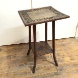 A 1920s oak plant stand, the square top with central panel surrounded by scrolling vine and fruit,