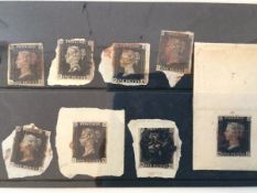 A selection of eight penny blacks, many margin and still on piece