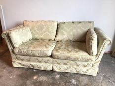 A Wade Furniture three seater sofa, with hump back above scroll arms in a floral damask