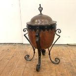 Manner of Dr. Christopher Dresser: an Aesthetic copper and iron scuttle, with wrought-iron handle,