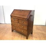 A George II Irish walnut bureau, c. 1750, the fall front enclosing a fitted interior with shaped