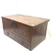 A late 17th century oak box, with carved front and drawer below (probably altered). 36.5cm by 76cm