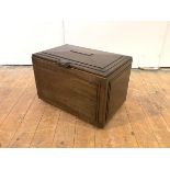 In the manner of Sir Robert Lorimer, an early 20th century walnut cellaret or log box by Whytock &