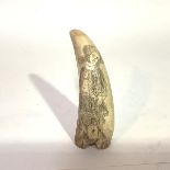 A 19th century sailor's scrimshaw whale's tooth, decorated with a young girl in hat and flounced