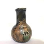 A Continental painted green onion bottle, with broad neck, decorated to one side with a girl in a