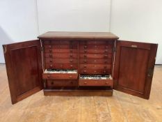 A late 19th century stained pine specimen cabinet, by J.T. Crockett & Son, Princes St. and Cavendish