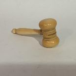 A 19th century carved ivory gavel, with turned handle, inscribed "For God and King". Length 12.5cm