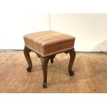 A mid-19th century rosewood stool, the upholstered seat raised on cabriole legs and scroll feet.