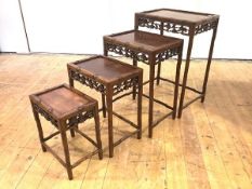 A late 19th/early 20th century set of four Chinese graduated hardwood occasional tables, each with