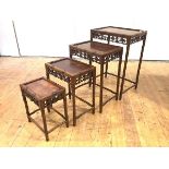 A late 19th/early 20th century set of four Chinese graduated hardwood occasional tables, each with