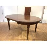 A 19th century mahogany telescopic dining table, the elliptical-shaped ends enclosing two additional