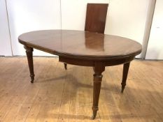 A 19th century mahogany telescopic dining table, the elliptical-shaped ends enclosing two additional