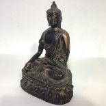 A Chinese gilt-bronze figure of Buddha Sakyamuni, probably Ming Dynasty, seated in meditative