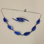 Karl Rasmussen, a Norwegian sterling silver and enamel necklace, of six leaf-shaped panels, in royal