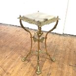 An elaborate onyx and brass-mounted stand, the square top within a pierced border incorporating