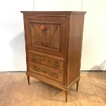 A late 19th century Swiss walnut secretaire abattant, the projecting cornice over a fall front