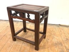 A Chinese hardwood occasional table, early 20th century, with recessed rectangular top and pierced