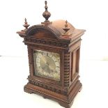 A late 19th century German walnut mantel clock, with brass dial, the silvered chapter ring with