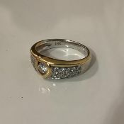 An 18ct gold diamond dress ring, set to the centre with a round brilliant-cut stone weighing approx.