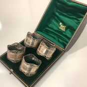 A cased set of four late Victorian silver napkin rings, Roberts & Belk, Sheffield 1901 (one marked