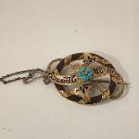 A mid-19th century diamond, turquoise and enamelled gold mourning brooch, centred by a collet-set