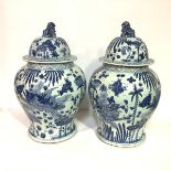 A pair of large Chinese blue and white porcelain baluster jars and covers, 20th century, each