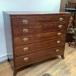 A George IV mahogany and boxwood-lined chest of drawers, of five long graduated drawers, raised on