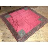 An unusual 19th century woollen Paisley shawl, worked with a large cherry red central panel, the