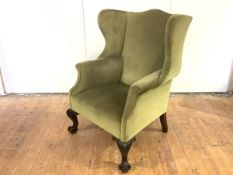 A late 19th/early 20th century mahogany wing armchair, of George II style, with cream velvet