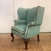 A Scottish George II walnut wing or 'lug' armchair, c. 1750, the duck-egg upholstery with red velvet