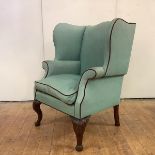 A Scottish George II walnut wing or 'lug' armchair, c. 1750, the duck-egg upholstery with red velvet