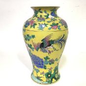 A Chinese famille jaune porcelain baluster vase, painted with pheasants amidst flowering boughs