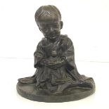 Japanese School, 20th Century, A Seated Child Holding a Doll, patinated bronze, unsigned. Height