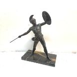 A bronzed metal figure of a Greek warrior, early 20th century, modelled with shield on upraised left