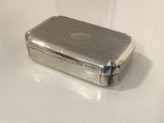 A George III silver snuff box, London 1811 (maker's mark indistinct), of rectangular form, with