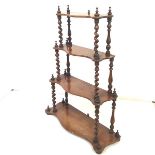 A set of Victorian mahogany graduated shelves, of small proportions, with spiral-turned supports.