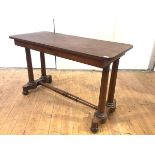 A 19th century mahogany centre table, c. 1840, the rectangular top raised on turned columns and a