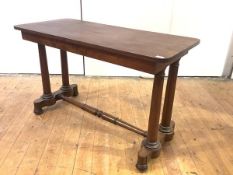 A 19th century mahogany centre table, c. 1840, the rectangular top raised on turned columns and a