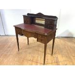 A late 19th century walnut and inlaid writing desk, the superstructure incorporating a mirror