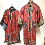 Two Chinese embroidered silk robes, probably c. 1900: the first with "mandarin" collar, of coat