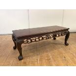 A Chinese hardwood low table, probably late 19th century, the rectangular top above a pierced