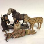 A group of early and mid-20th century animal toys comprising: a small ponyskin pony on a wooden