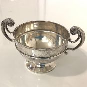 A George V silver twin-handled bowl, Walker & Hall, Sheffield, 1925, with bifurcated scroll handles,