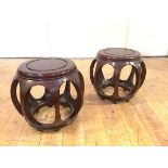 A pair of Chinese hardwood verandah stools, with dished seats. 34cm by 36cm diameter