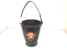 A leather fire bucket in 19th century style, of characteristic form, in black and applied with a red