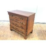 A 19th century mahogany chest in the George III style, of small proportions, the four long drawers