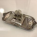 An Edwardian silver inkstand, Josiah Williams & Co., London 1906, the square glass well (possibly