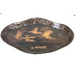 A large Chinoiserie gilt-decorated papier mache galleried tray, of shaped lozenge form, the well