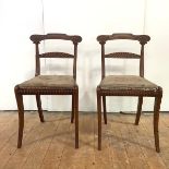 A good pair of Scottish Regency mahogany side chairs, c. 1820, each curved top rail with carved