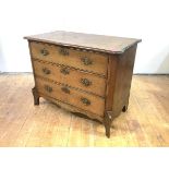 A 19th century French provincial oak chest of small proportions, with three graduated drawers on